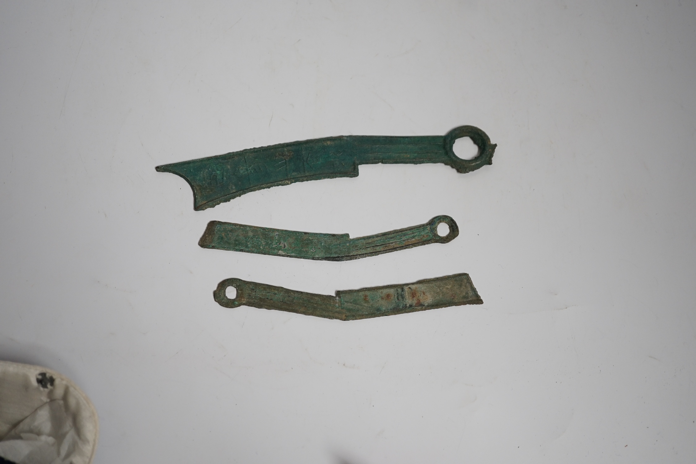 Seven Chinese bronze ‘knife’ cash, Han style